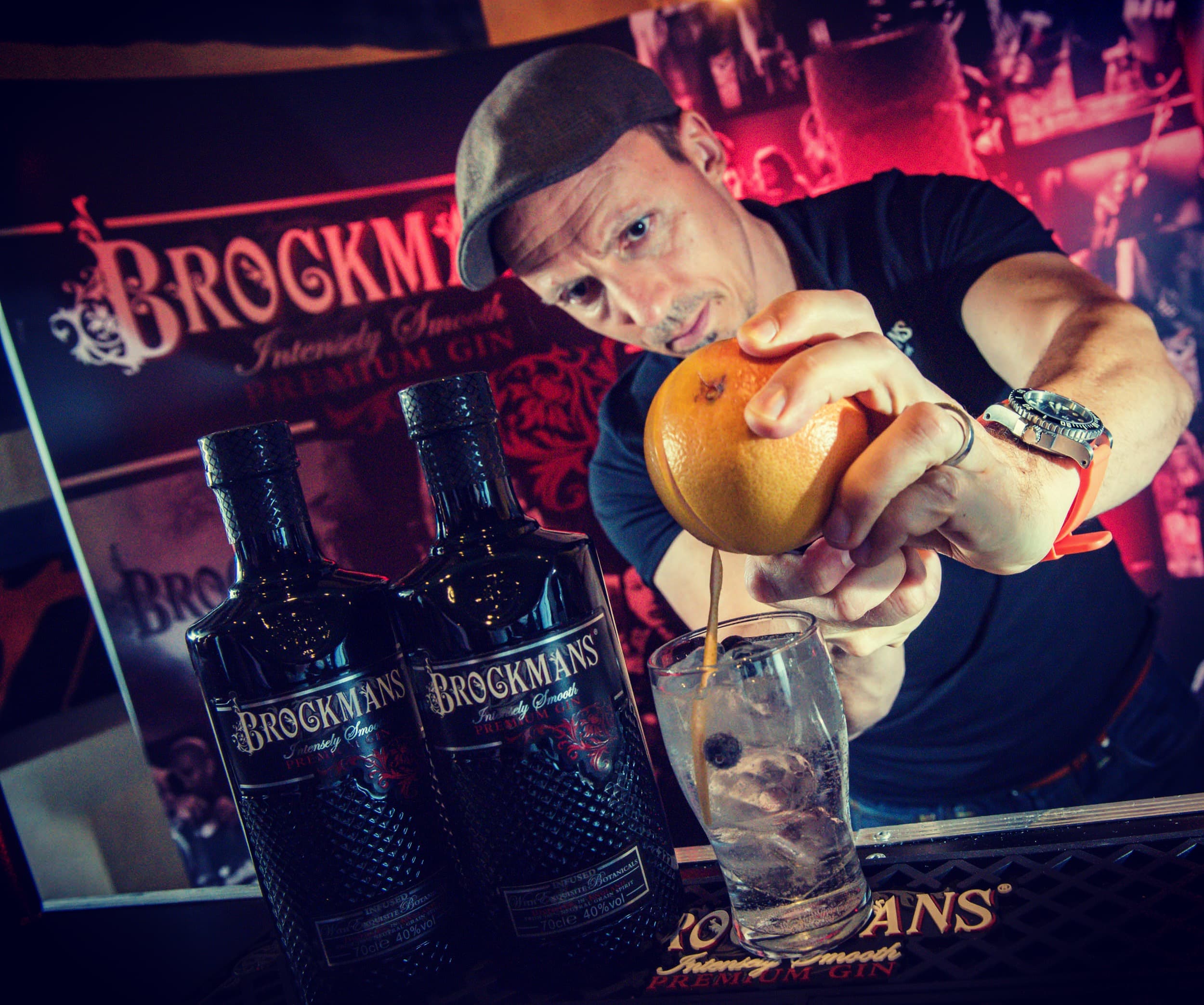 Barman pouring Brockmans cocktail