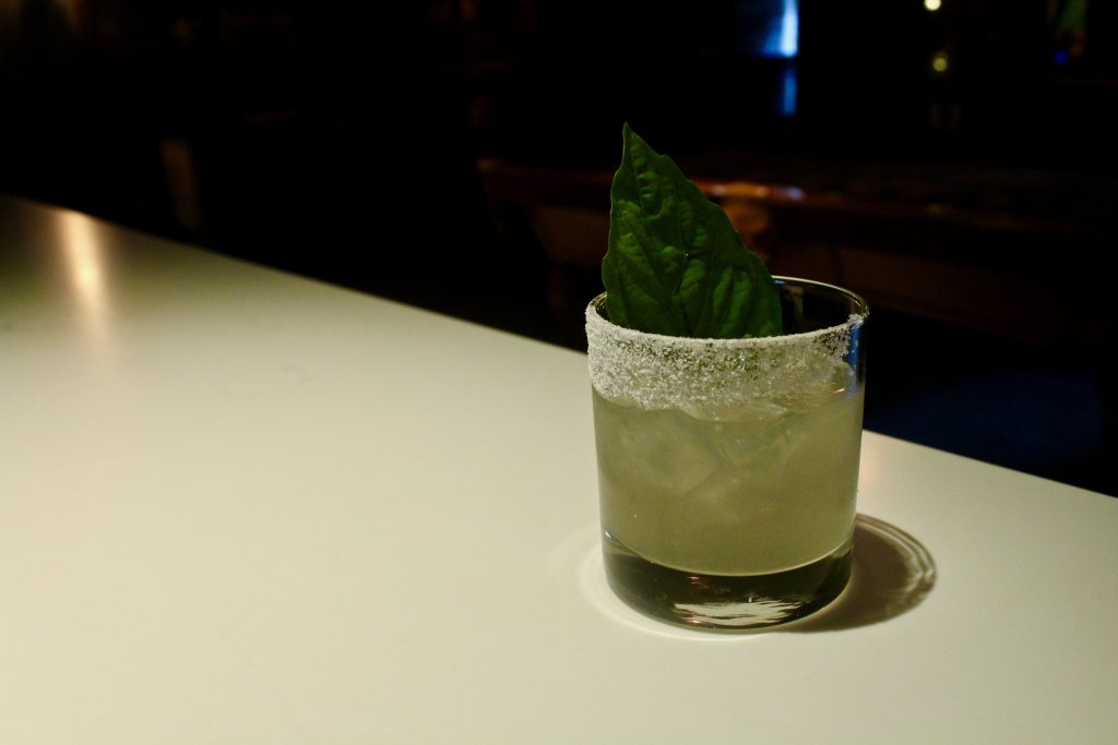 Nikki Diaz makes her Brockmans cocktail, the Black Widow, at Better Days in Miami