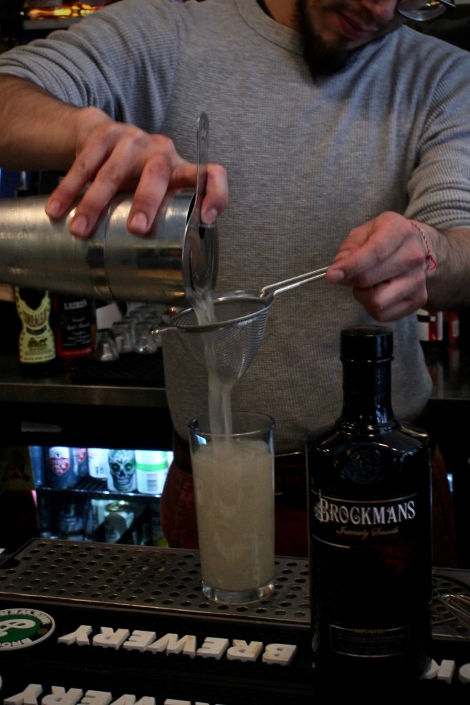 Leo Cazares makes his Brockmans cocktail, Summer Angel, at Erv's on Beekman in Brooklyn, New York.