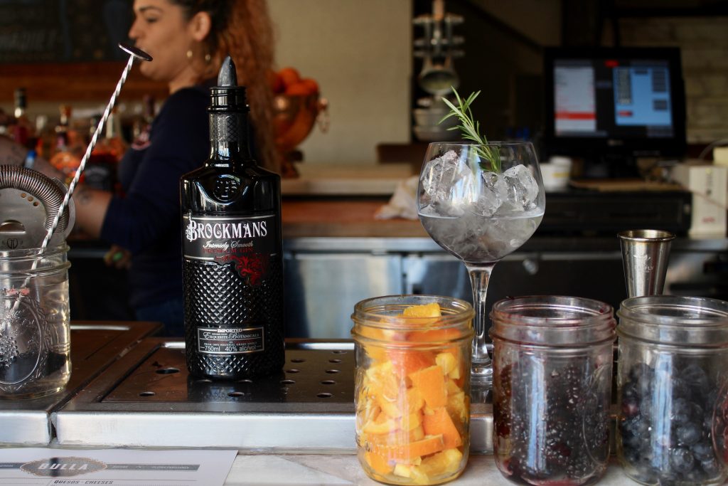 Joel Mesa makes a "Stay Classy," the Brockmans and tonic at Bulla Gastropub in Miami, Florida.