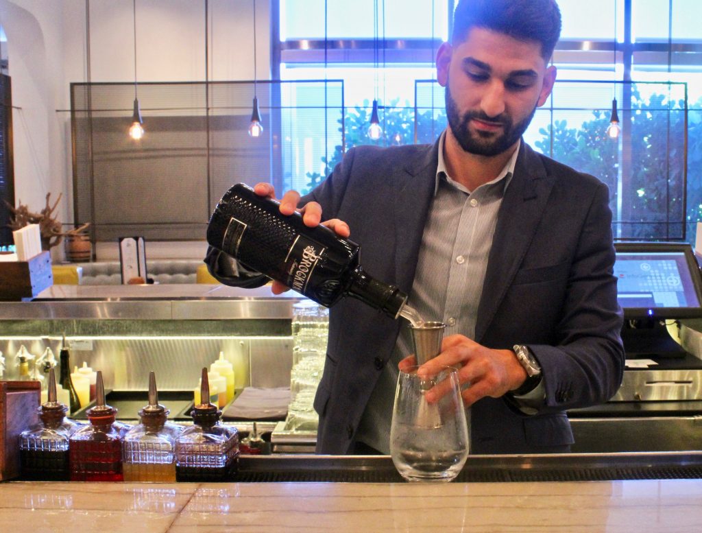 Sean Benna makes his Brockmans cocktail, the Fancy Shandy, at Edge Steak and Bar in the Four Seasons Miami