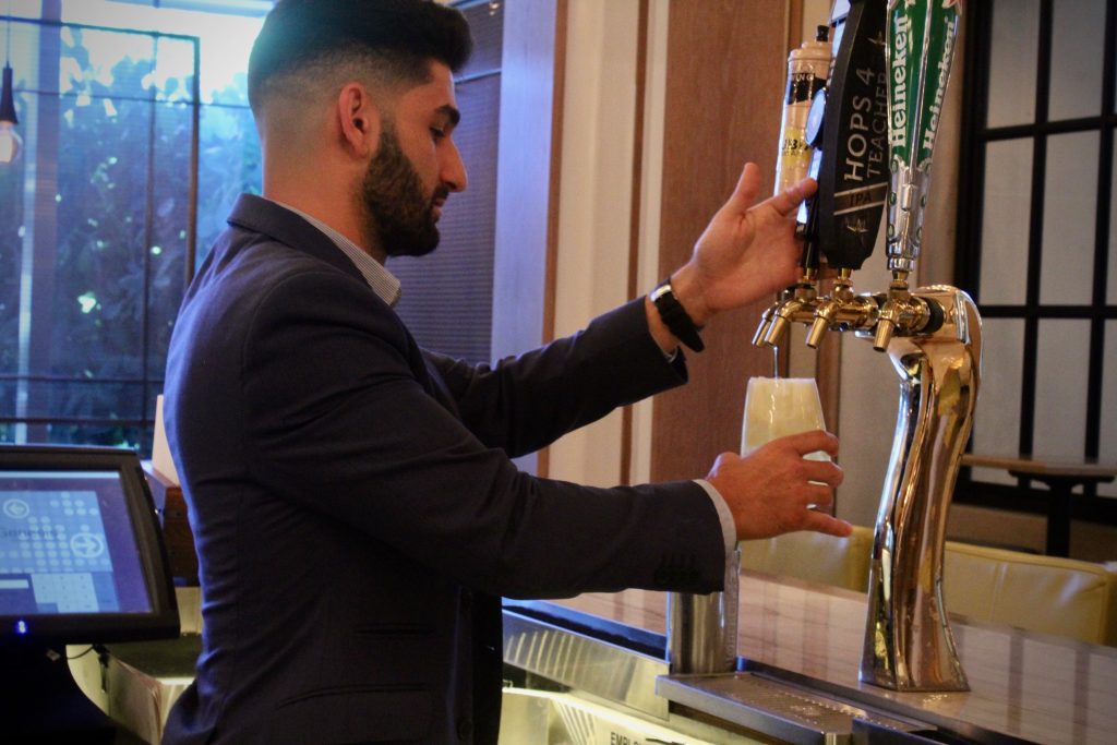 Sean Benna makes his Brockmans cocktail, the Fancy Shandy, at Edge Steak and Bar in the Four Seasons Miami