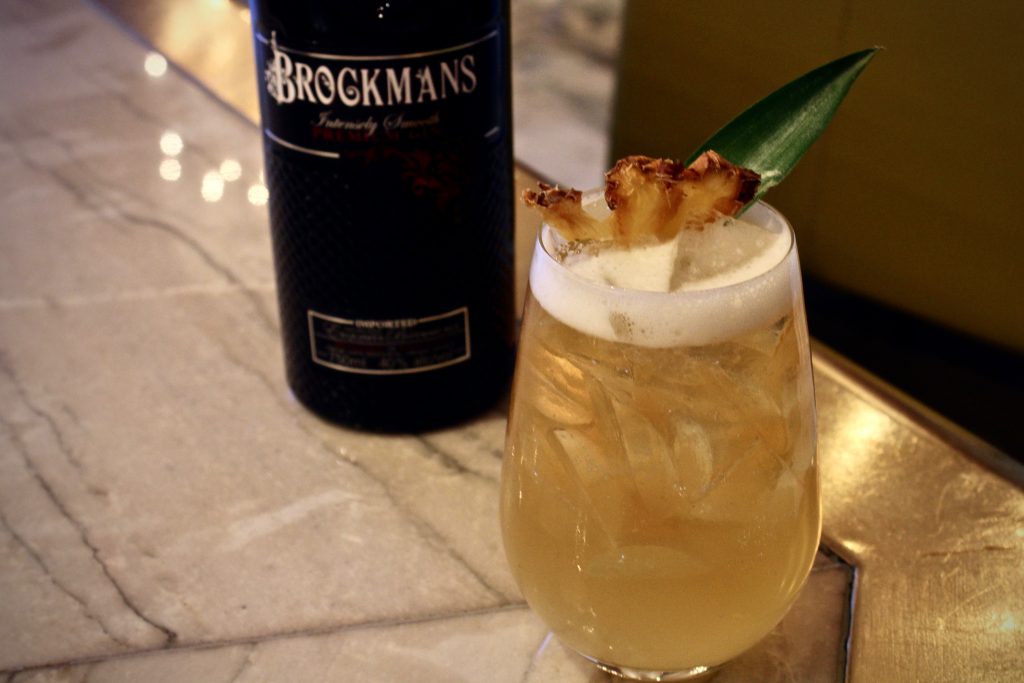 Sean Benna makes his Brockmans cocktail, the Fancy Shandy, at Edge Steak and Bar in the Four Seasons Miami