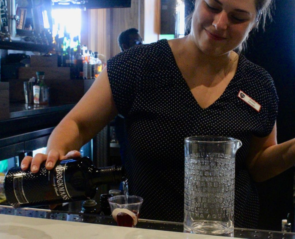 Jennie Kreider makes an original Brockmans cocktail at 1764 Public House in St. Louis, Missouri.
