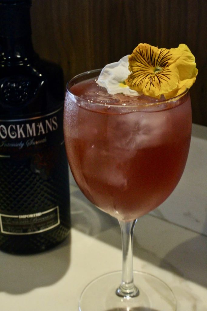 Jennie Kreider makes an original Brockmans cocktail at 1764 Public House in St. Louis, Missouri.