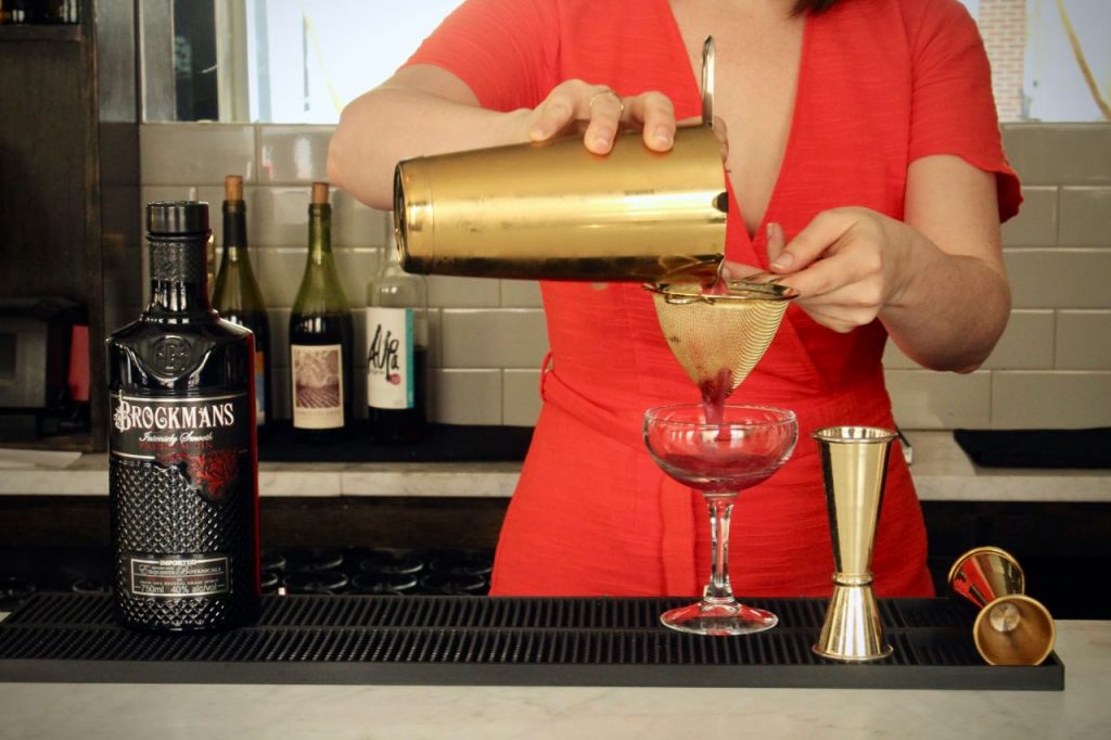 Amber Smith makes Maureen Shannon's Brockmans cocktail, the BFF 75 at Fishtown Social in Philadelphia