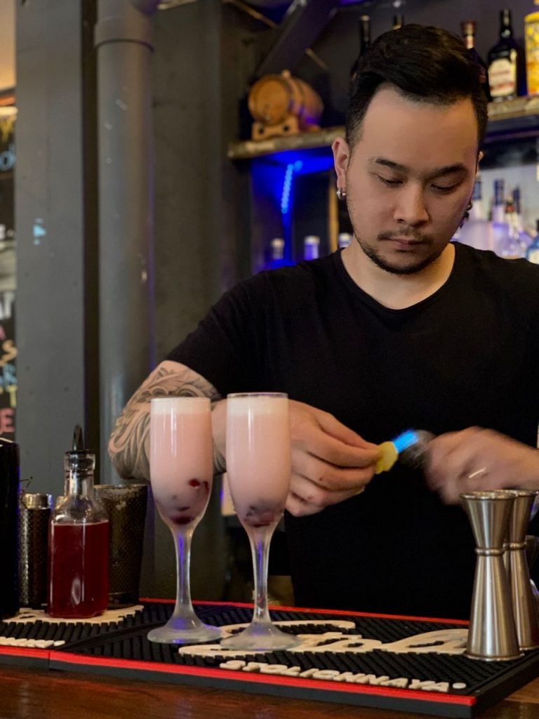 Bobby Chompupang makes his Brockmans cocktail, the Siam Orchid, at Bangkok Bistro in Burlington, Vermont