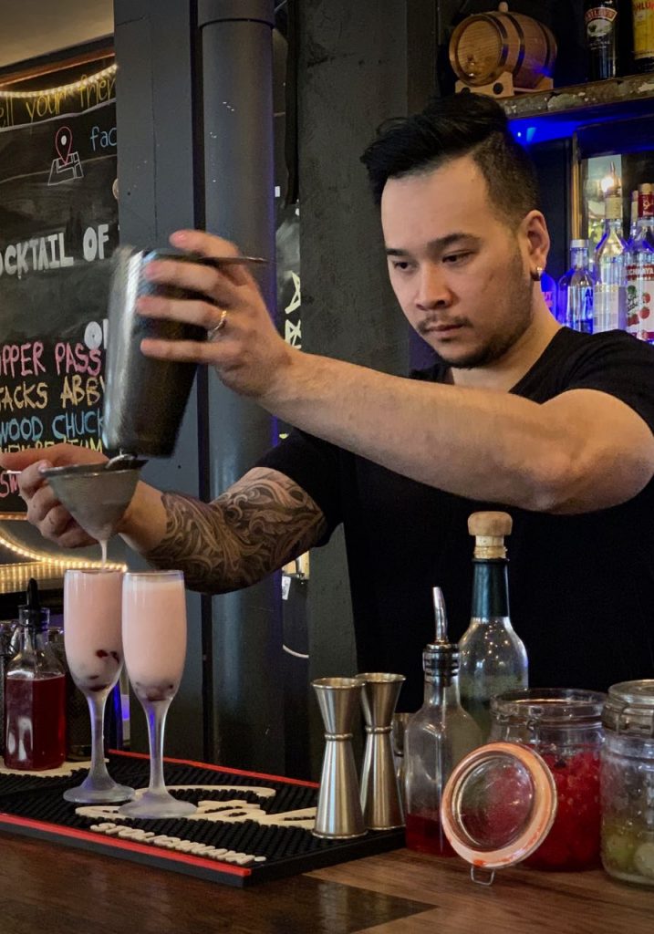 Bobby Chompupang makes his Brockmans cocktail, the Siam Orchid, at Bangkok Bistro in Burlington, Vermont