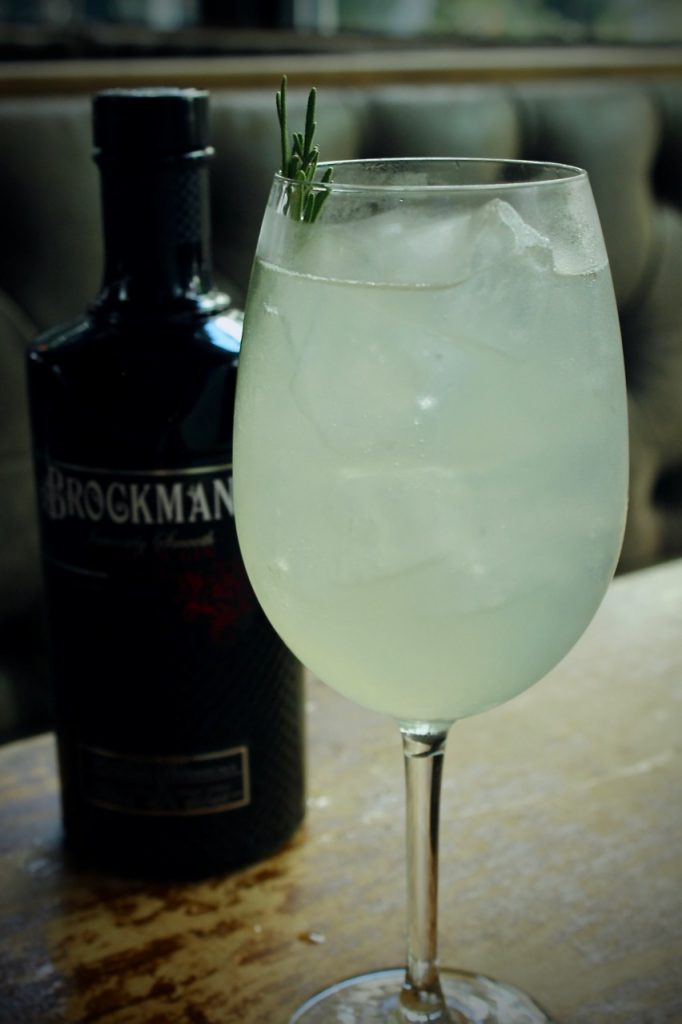 Michell Boyd makes her Brockmans cocktail, the "Blueberry Yum Yum" at Hampton and Hudson in Atlanta, Georgia.