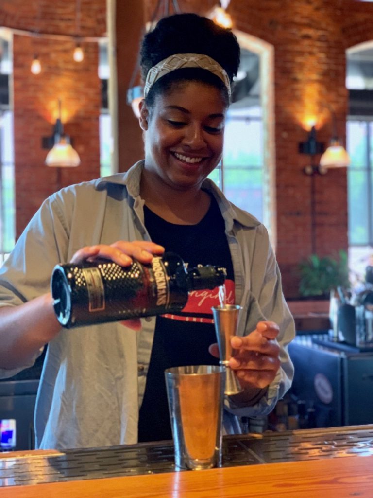 Nadia Womble makes her Brockmans cocktail, Strawberry Fields, at Waterworks Food + Drink in Winooski, Vermont.