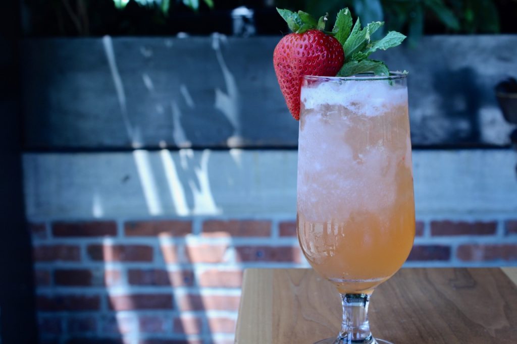 Nadia Womble makes her Brockmans cocktail, Strawberry Fields, at Waterworks Food + Drink in Winooski, Vermont.