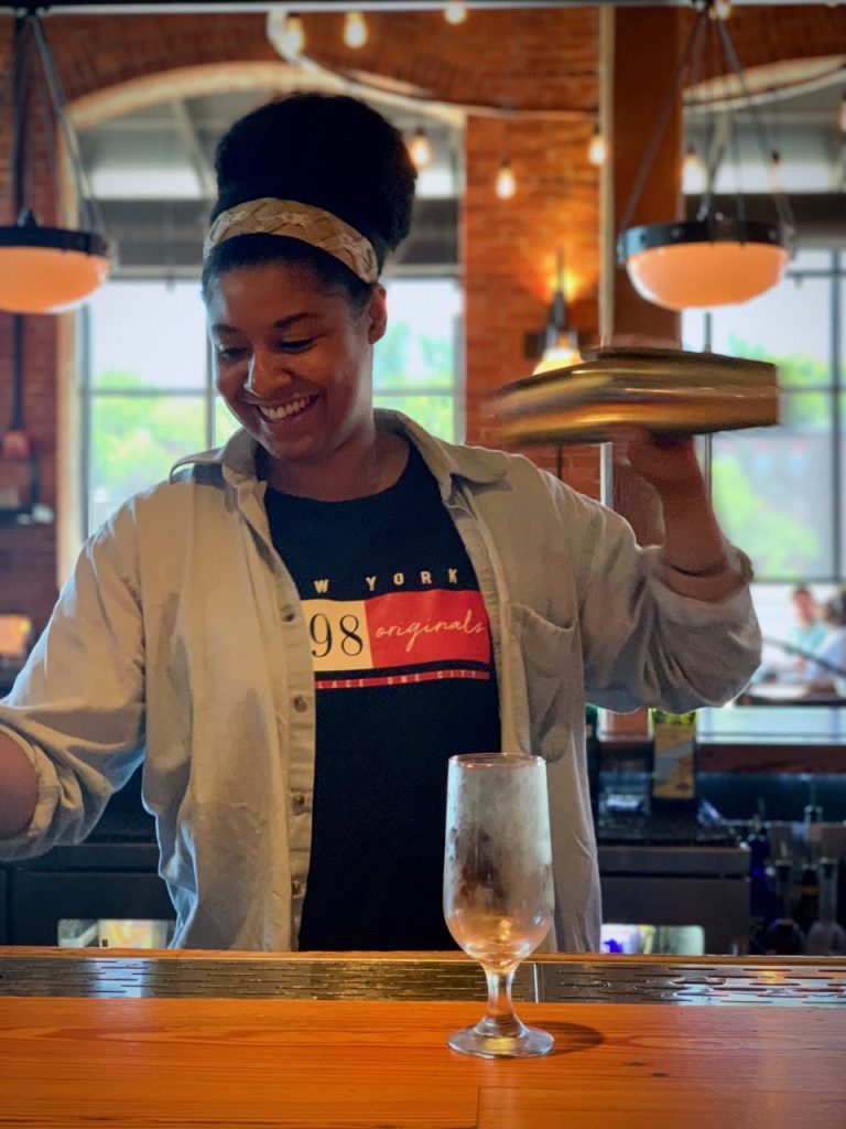 Nadia Womble makes her Brockmans cocktail, Strawberry Fields, at Waterworks Food + Drink in Winooski, Vermont.