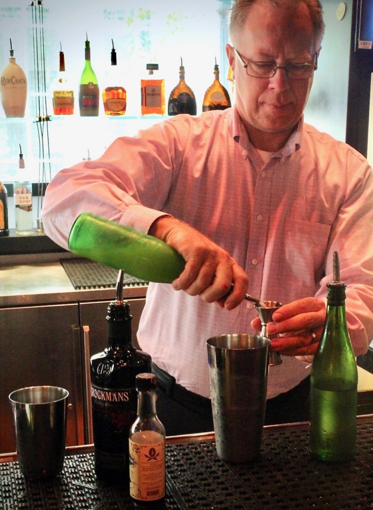 Rick Blumberg makes his Brockmans cocktail, the "Rambling Rose", at Marlow's Tavern in Atlanta, Georgia.