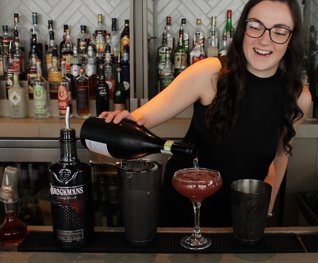 Baileigh Wilson makes her Brockmans cocktail, "You Had Me at Merlet", at The High Note in Atlanta, Georgia