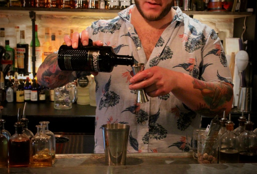 Dan Rek makes a classic tiki drink, the "Saturn," with a Brockmans twist, at Elm City Social in New Haven, Connecticut.