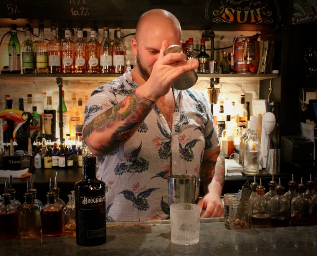 Dan Rek makes a classic tiki drink, the "Saturn," with a Brockmans twist, at Elm City Social in New Haven, Connecticut.